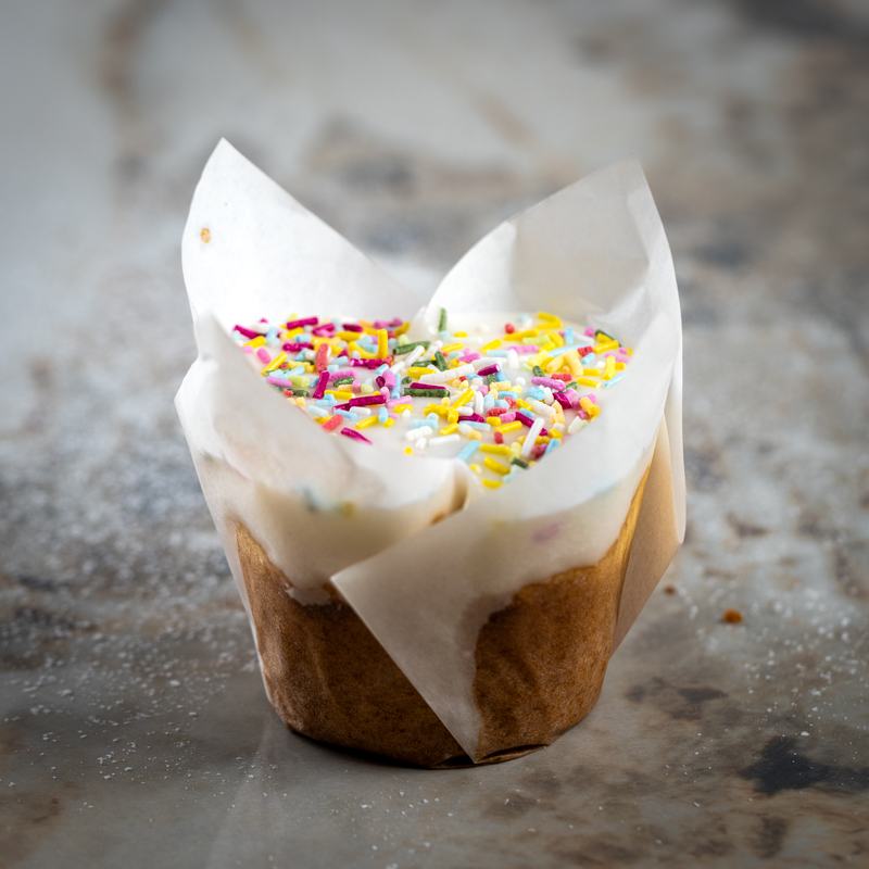 Funfetti cupcake with rainbow sprinkles in a tulip wrapper
